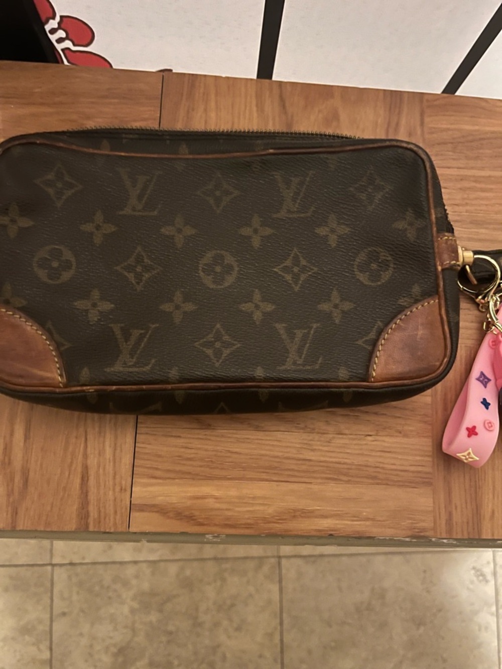 Louis Vuitton Brown Monogram Clutch with Pink Charm - Picture 2 of 13
